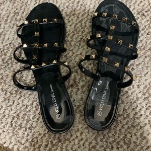 Black sandals with gold studs